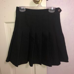 Black pleated skirt.